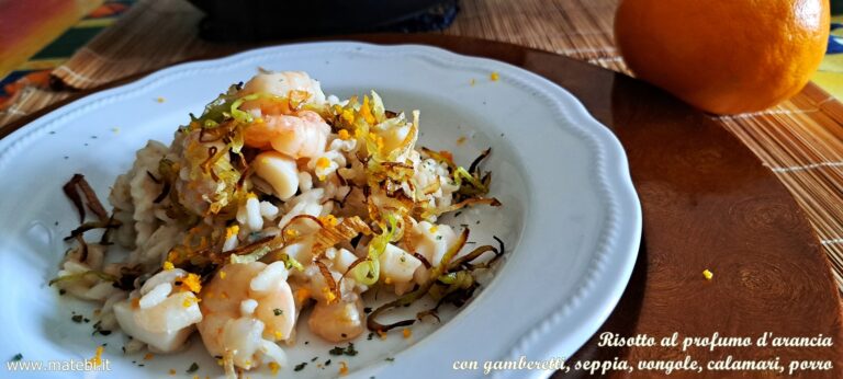 Risotto al profumo d'arancia con gamberetti, seppia, vongole, calamari, porro